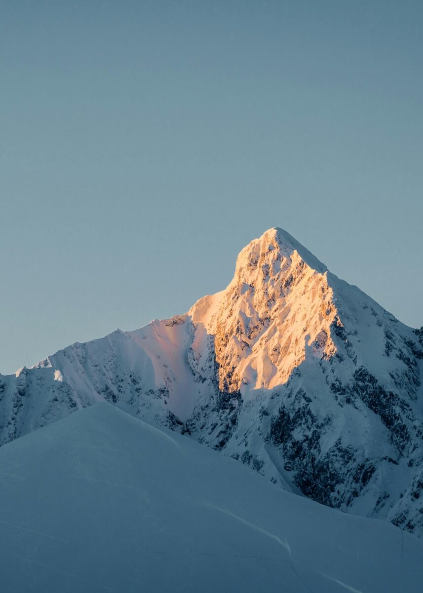snow covered mountain under blue sky during daytime